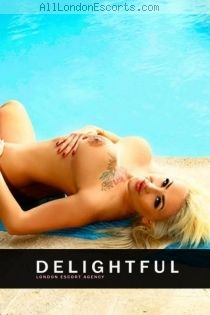 Raisa escort - 32DD bust, blonde hair, green eyes